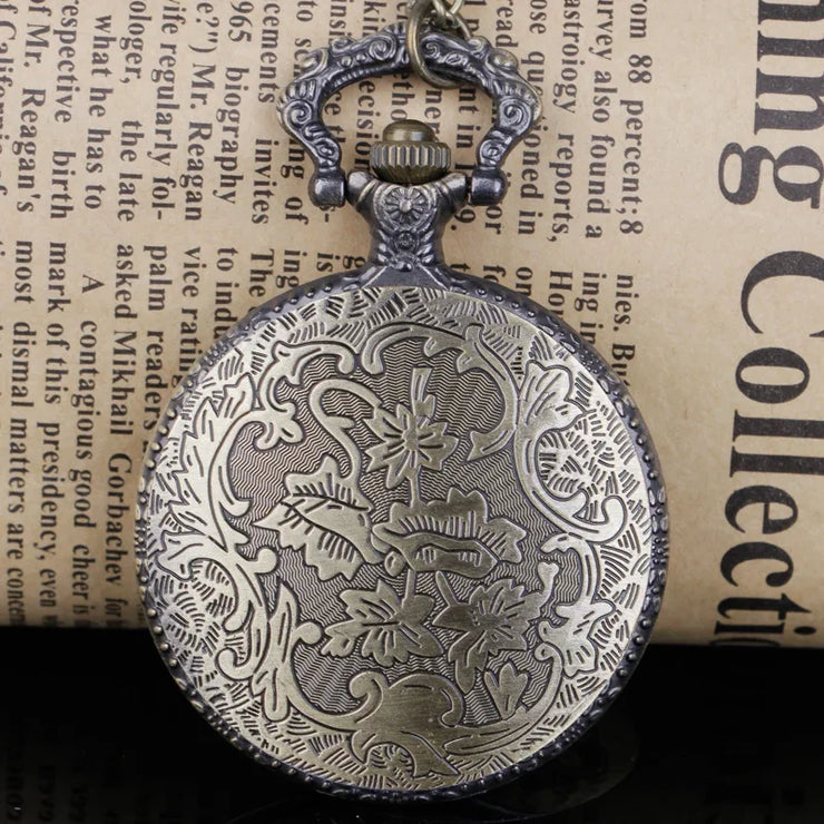 Silver pocket watch with classic round face and roman numerals.