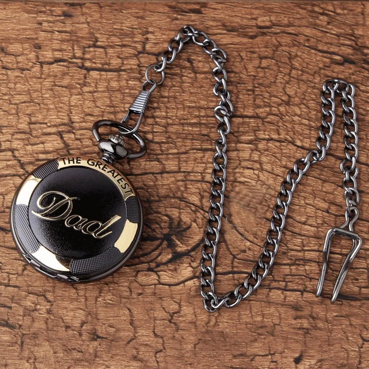  A dark spherical locket with a unique textured surface, resting on a rustic stone background with a black chain.