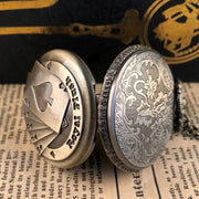 Side view of the vintage bronze poker quartz pocket watch showcasing its engraved floral back cover and royal flush front design.